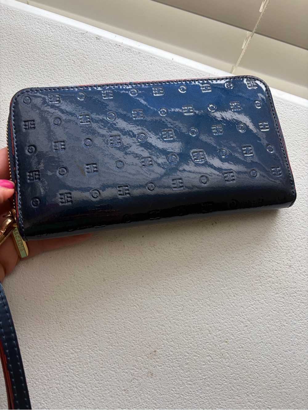 Arcadia Navy Patent Zip Wallet with Embossed Logo Pattern